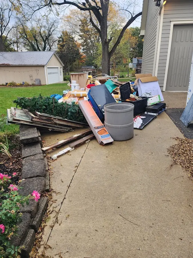 Dumpster being loaded with debris for Commercial Dumpster Rental in Leakesville
